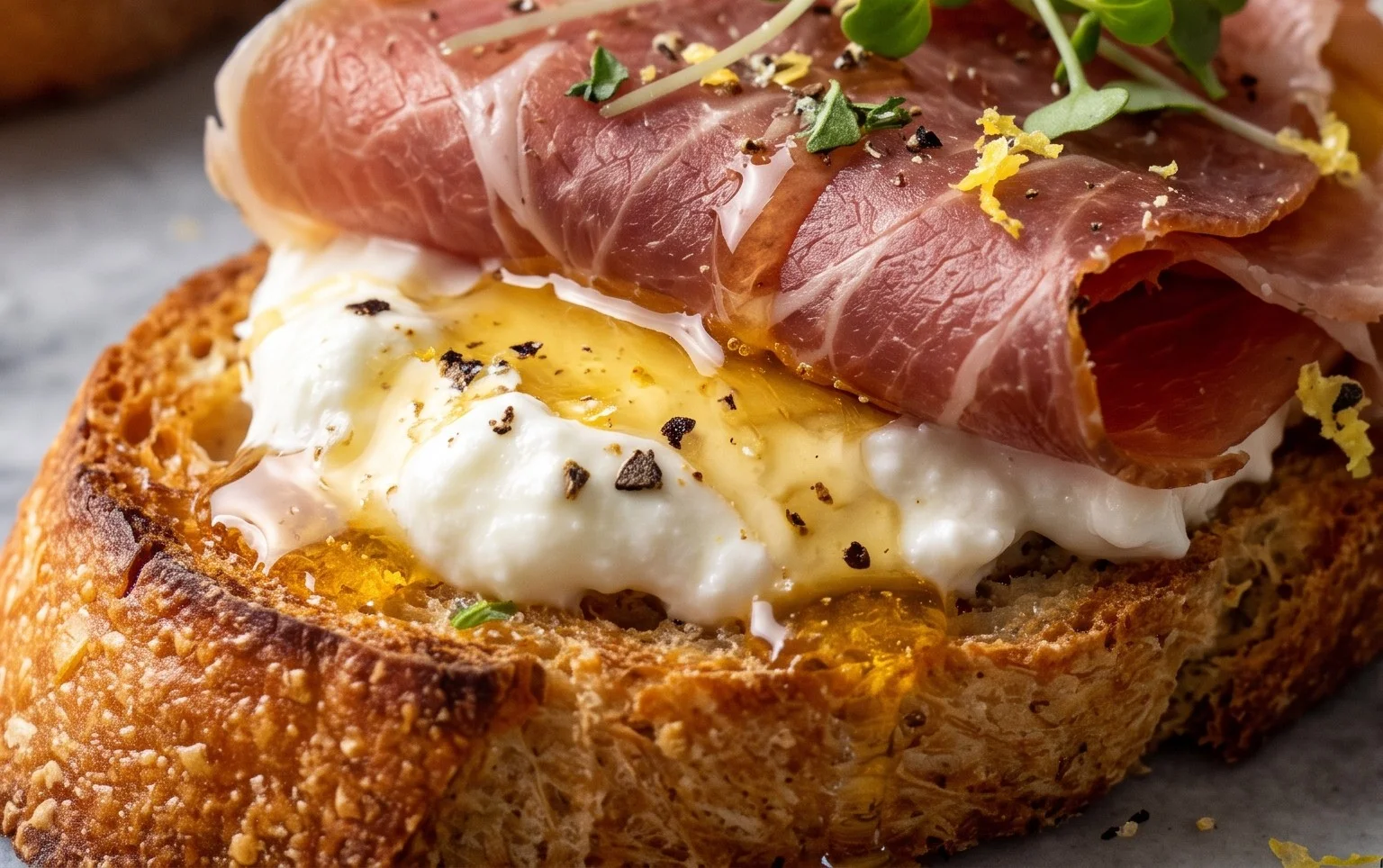 Beef Prosciutto Crostini with Burrata and Lemon Honey Drizzle
